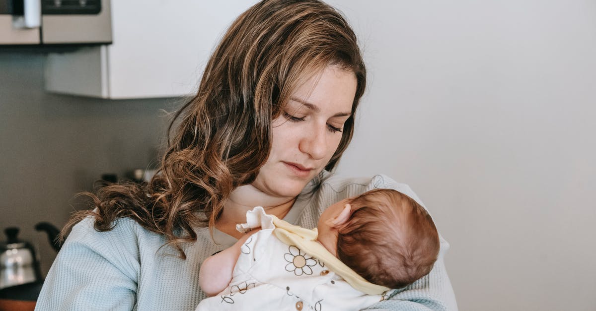 Travelling with Infant to Hong Kong - Need to use Kitchen - Mother with newborn baby in kitchen Travelling with Infant to Hong Kong - Need to use Kitchen - Mother with newborn baby in kitchen