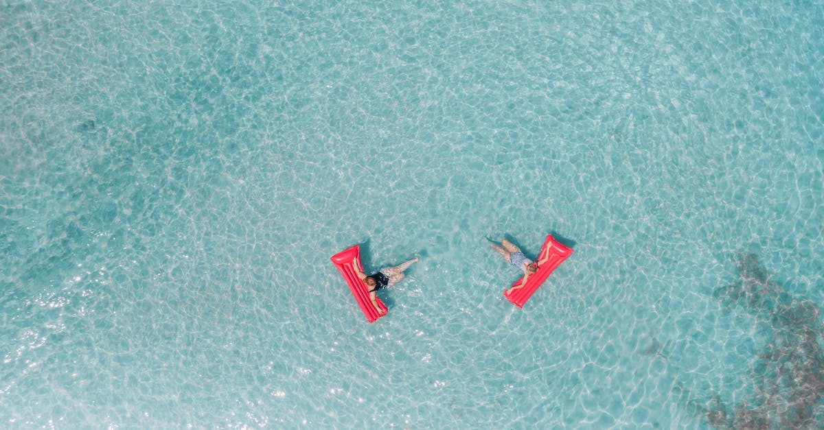 Tropical islands, Berlin, Germany. Inflatable "toys"? - People Lying on an Inflatable Floater on the Beach Tropical islands, Berlin, Germany. Inflatable "toys"? - People Lying on an Inflatable Floater on the Beach
