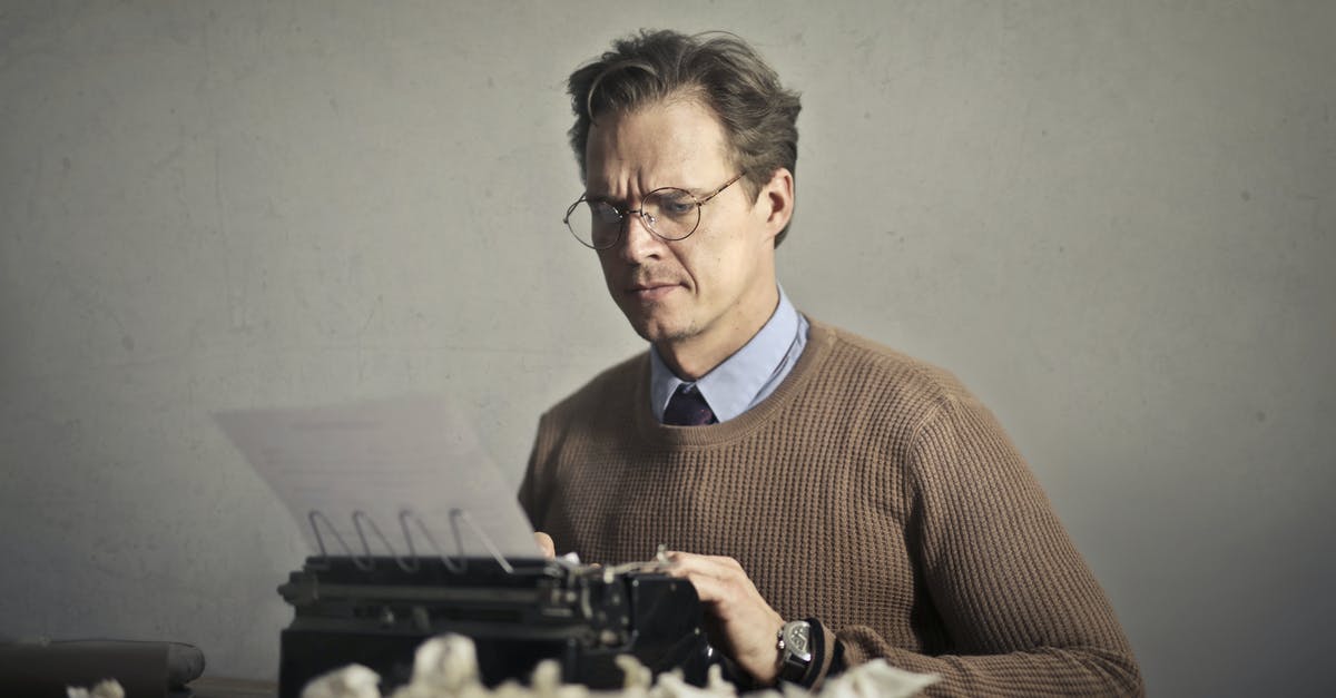 Trouble regarding Booking Tickets - Adult frowned male writer working on typewriter at home Trouble regarding Booking Tickets - Adult frowned male writer working on typewriter at home