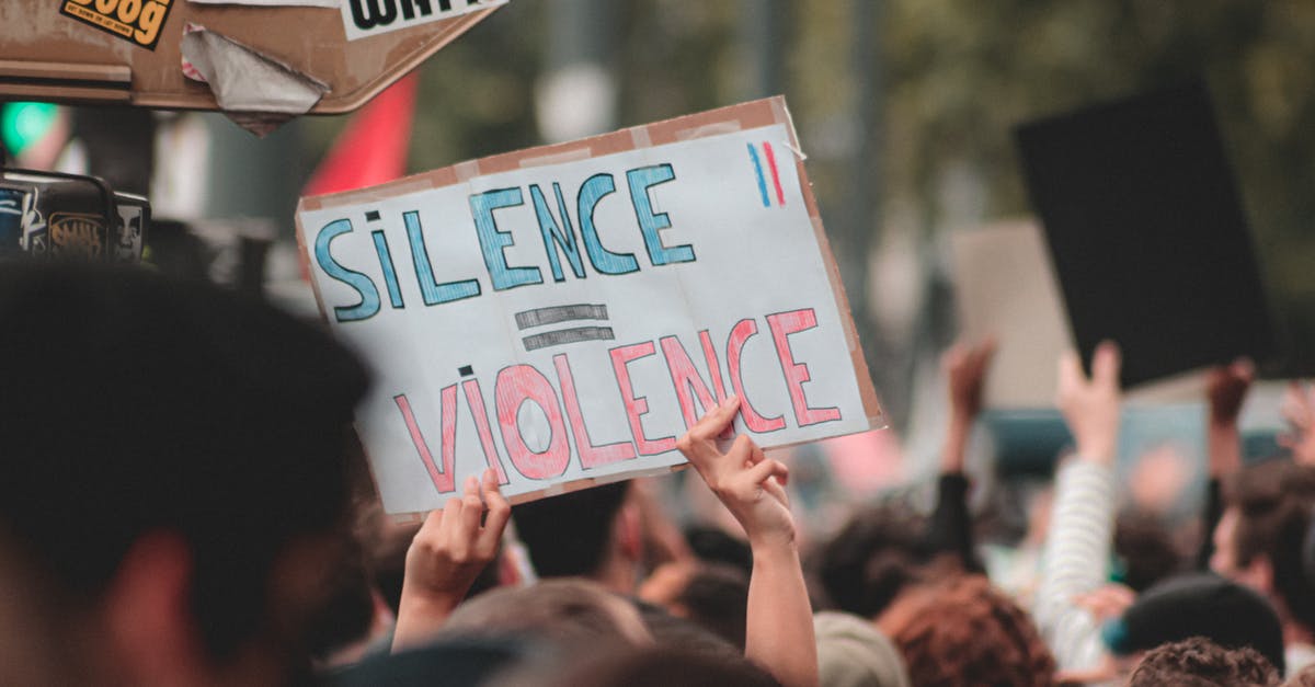 Trying to gather the right documents for my next application - Anonymous person with poster Silence is Violence standing near board with stickers during peaceful Black Lives Matter protest Trying to gather the right documents for my next application - Anonymous person with poster Silence is Violence standing near board with stickers during peaceful Black Lives Matter protest