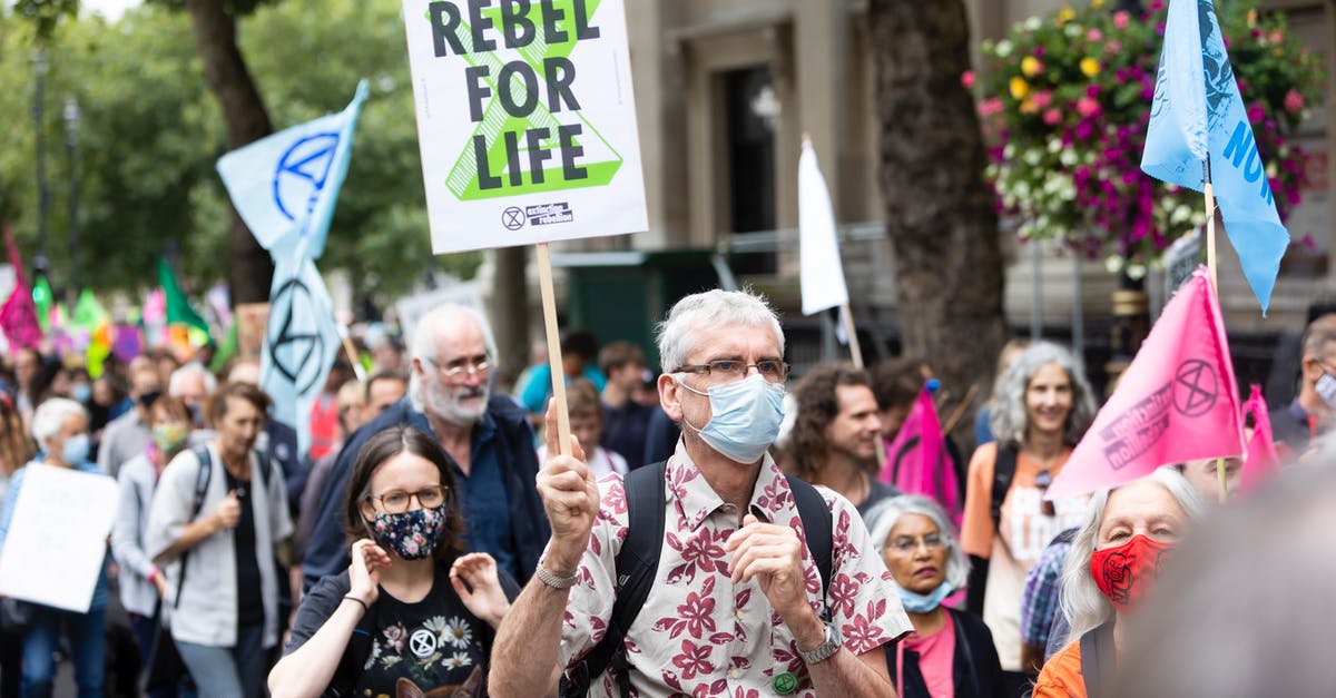 Trying to gather the right documents for my next application - Crowd of people with placards and banners on demonstration Trying to gather the right documents for my next application - Crowd of people with placards and banners on demonstration