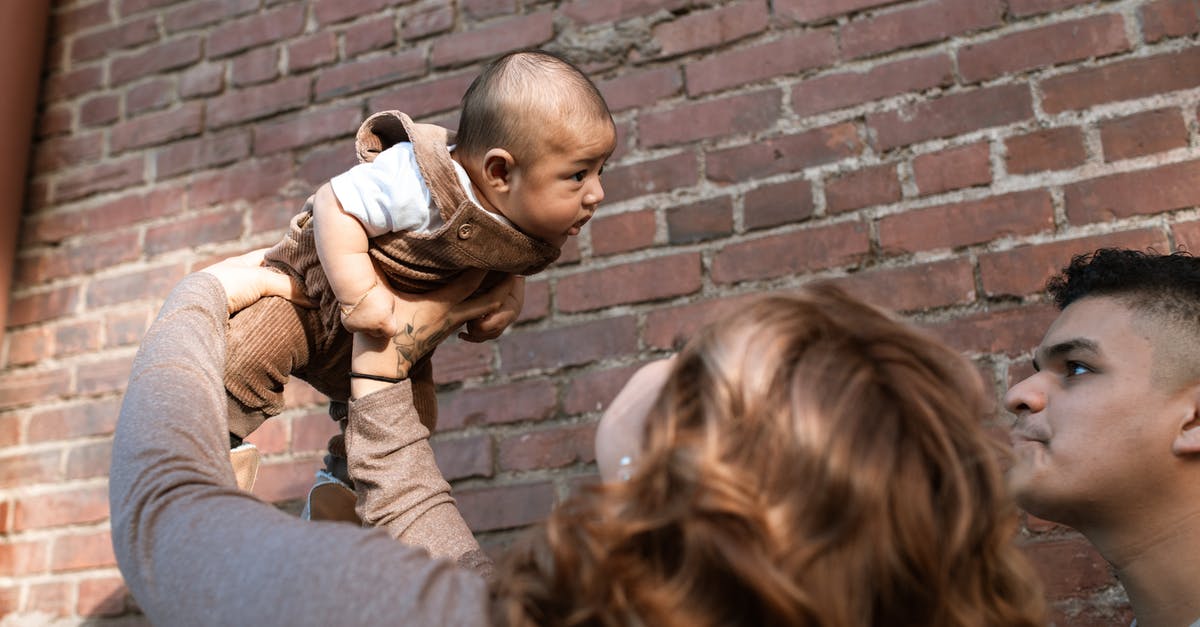 TTP (Nexus) times for parents vs. kids - Woman in Brown Long Sleeve Shirt Carrying Baby in White Shirt TTP (Nexus) times for parents vs. kids - Woman in Brown Long Sleeve Shirt Carrying Baby in White Shirt