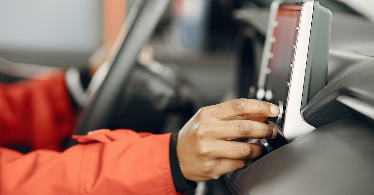 Turning off GPS on a flight? - Hand of a Person Turning On Car Stereo Turning off GPS on a flight? - Hand of a Person Turning On Car Stereo