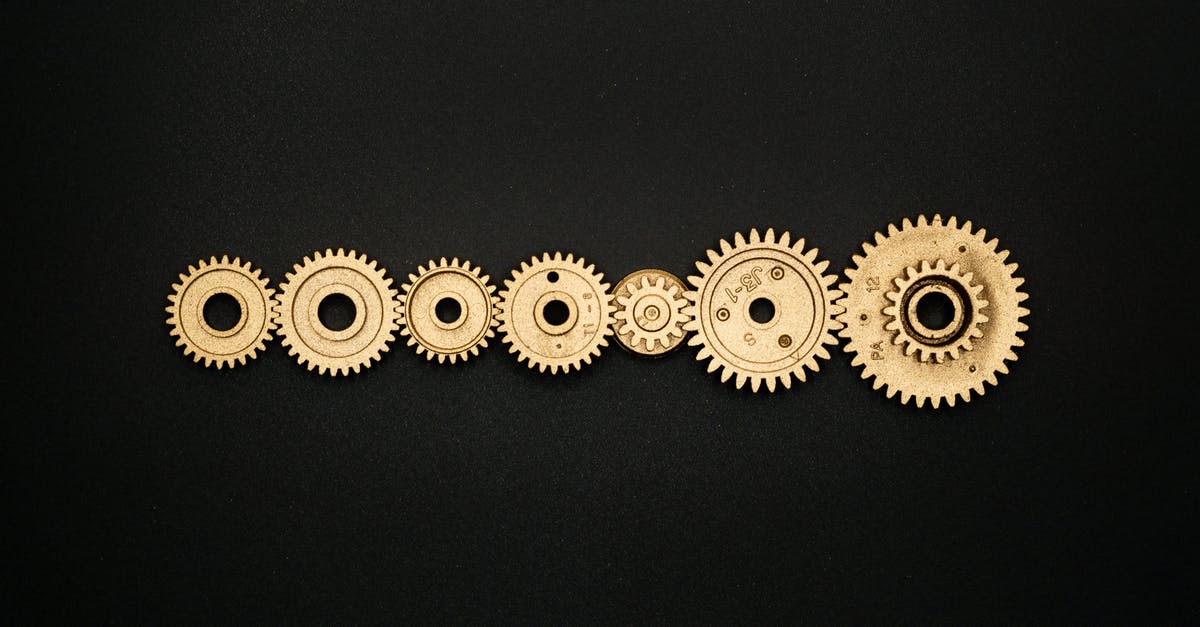 Turning off GPS on a flight? - Photo of Golden Cogwheel on Black Background Turning off GPS on a flight? - Photo of Golden Cogwheel on Black Background