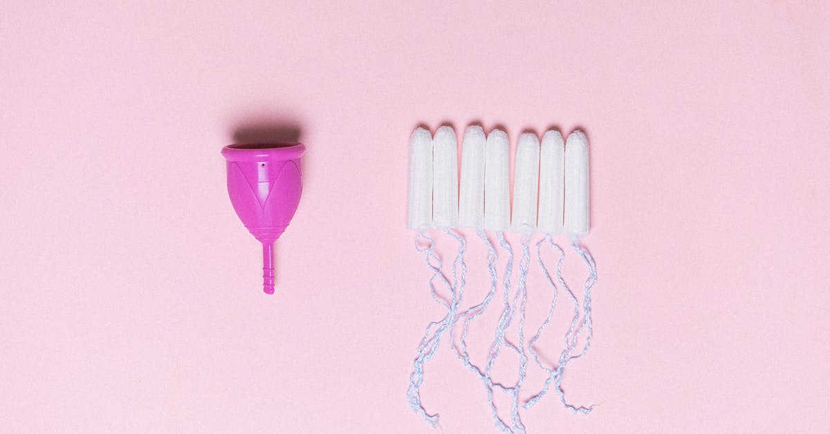 Two different workshops in one J-1 visa period - Menstrual cup and tampons arranged on pink surface Two different workshops in one J-1 visa period - Menstrual cup and tampons arranged on pink surface