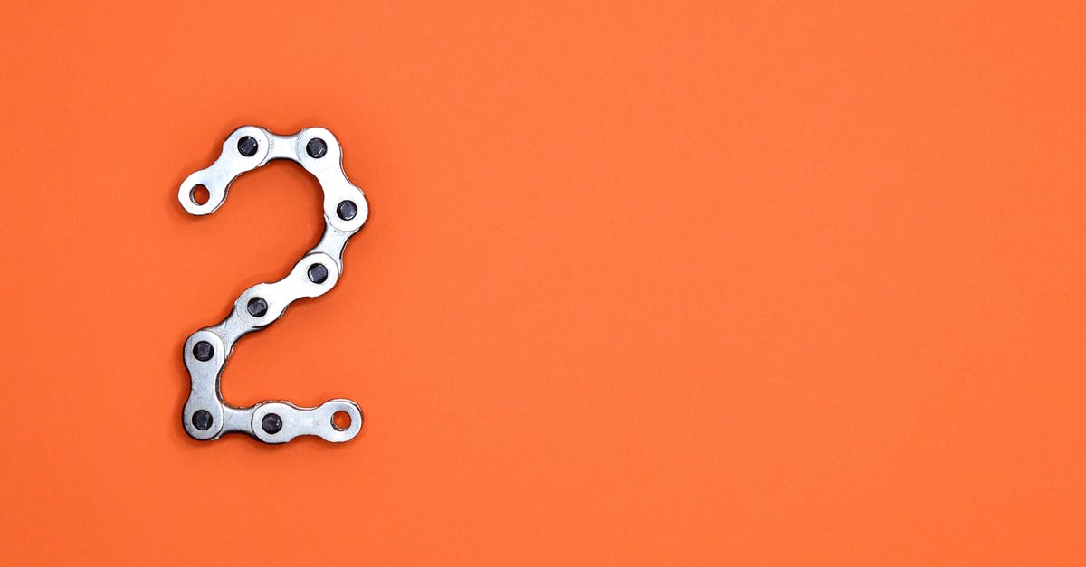 Two flights with the same number and same destination, 15 minutes apart - Gray Steel Chain on Orange Surface Two flights with the same number and same destination, 15 minutes apart - Gray Steel Chain on Orange Surface