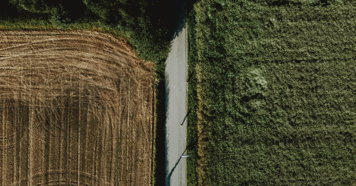 Two passports in different names, stopover country needs one, destination — the other - Agricultural plantations with different fields on sunny day Two passports in different names, stopover country needs one, destination — the other - Agricultural plantations with different fields on sunny day