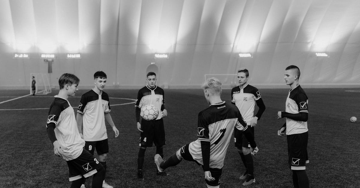 Two Weeks in Cambridge (England), practicing sport in group - Grayscale Photo of Soccer Players Practicing Two Weeks in Cambridge (England), practicing sport in group - Grayscale Photo of Soccer Players Practicing