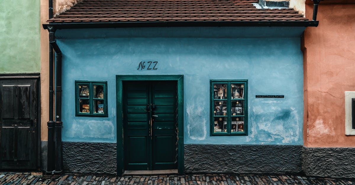 Uber from the airport in Prague - pickup location and reliability? - Historic old street with colorful houses in city district Uber from the airport in Prague - pickup location and reliability? - Historic old street with colorful houses in city district