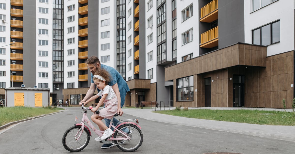 UIAA membership and guides - A Man Teaching His Daughter How to Ride a Bike UIAA membership and guides - A Man Teaching His Daughter How to Ride a Bike