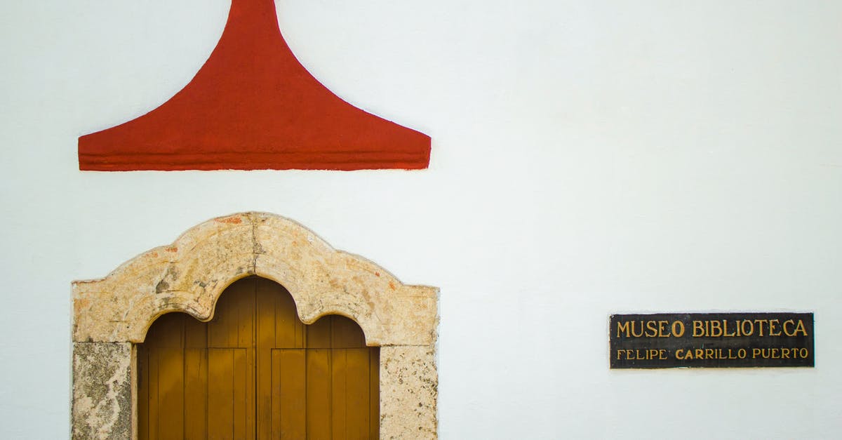 UK - Spousal Visa Travelling to Mexico for Holiday - Traditional Mexican building with aged wooden door in sunlight UK - Spousal Visa Travelling to Mexico for Holiday - Traditional Mexican building with aged wooden door in sunlight