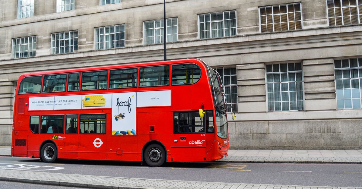 UK DATV - Evidence onward journey is booked - Red double decker bus following on street UK DATV - Evidence onward journey is booked - Red double decker bus following on street
