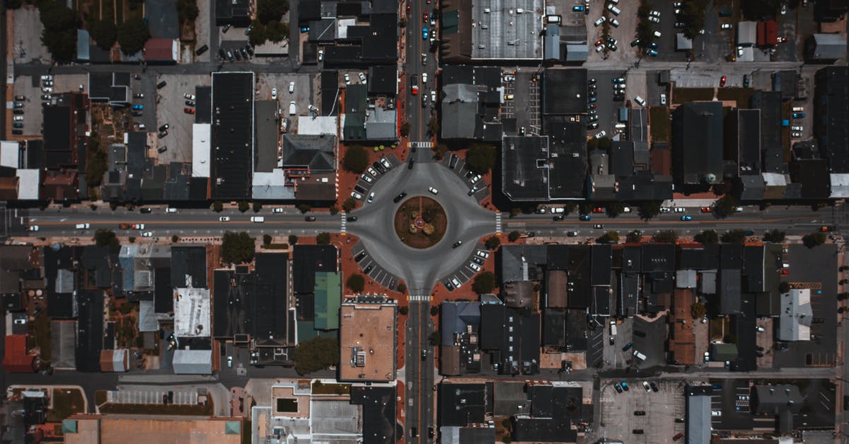UK DATV visa for round trip - Cityscape with circle junction and roads between buildings UK DATV visa for round trip - Cityscape with circle junction and roads between buildings
