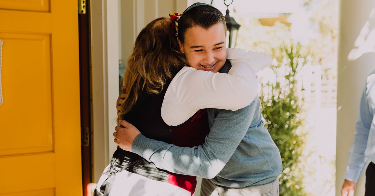 UK Family Visitor Visa Query - Photo Of People Hugging Each Other In Front Door UK Family Visitor Visa Query - Photo Of People Hugging Each Other In Front Door