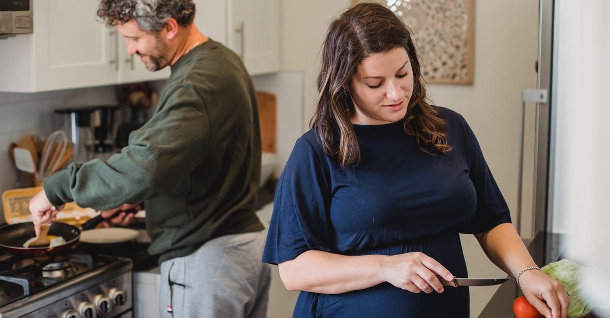 UK Marriage Visitor Visa (MVV) refusal and subsequent fresh application - Cheerful couple cooking dinner in kitchen UK Marriage Visitor Visa (MVV) refusal and subsequent fresh application - Cheerful couple cooking dinner in kitchen