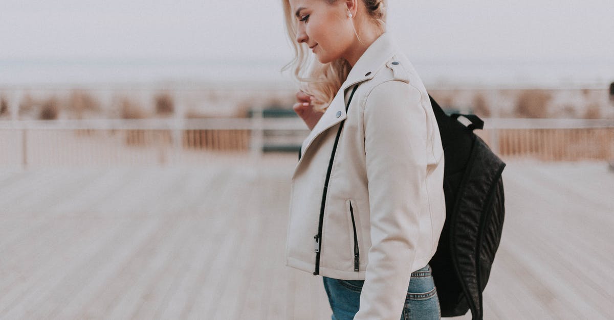 UK marriage visitor visa with children traveling - Woman in Black Zip-up Jacket With Black Backpack UK marriage visitor visa with children traveling - Woman in Black Zip-up Jacket With Black Backpack