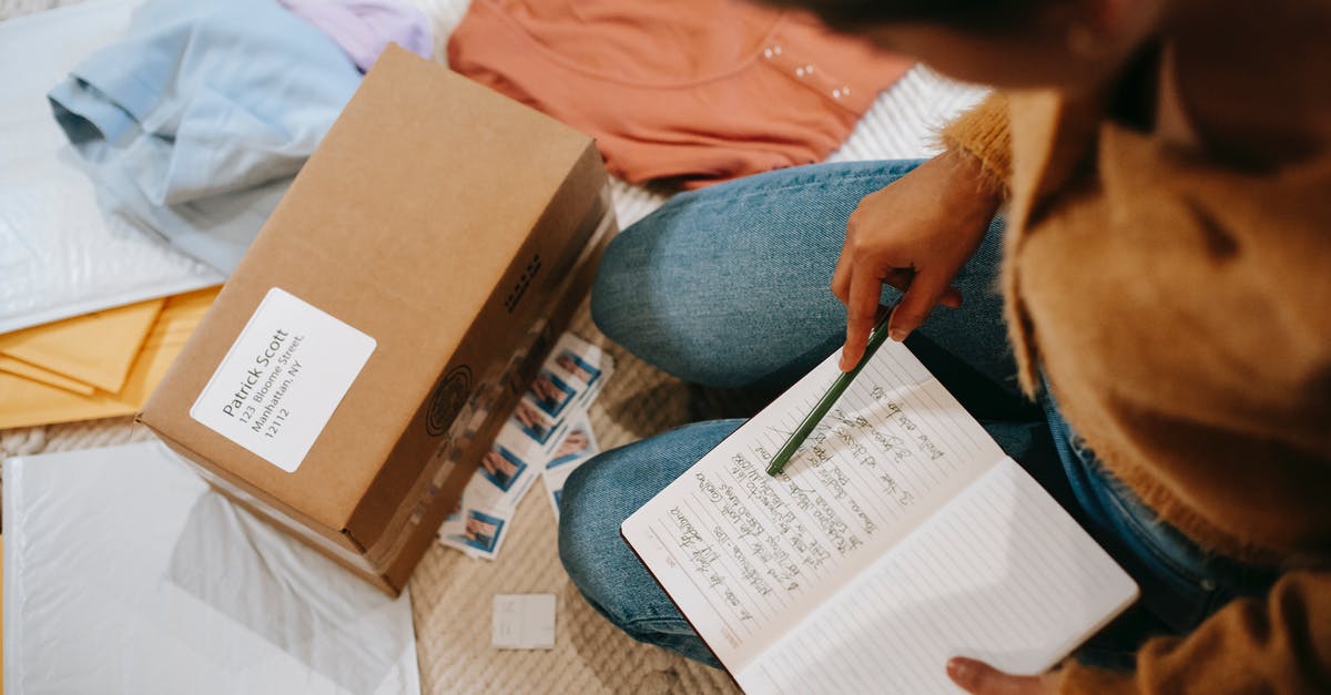 UK no border stamp. How do I check if my visa information passed to immigration service? [duplicate] - Woman comparing information in notebook and carton box