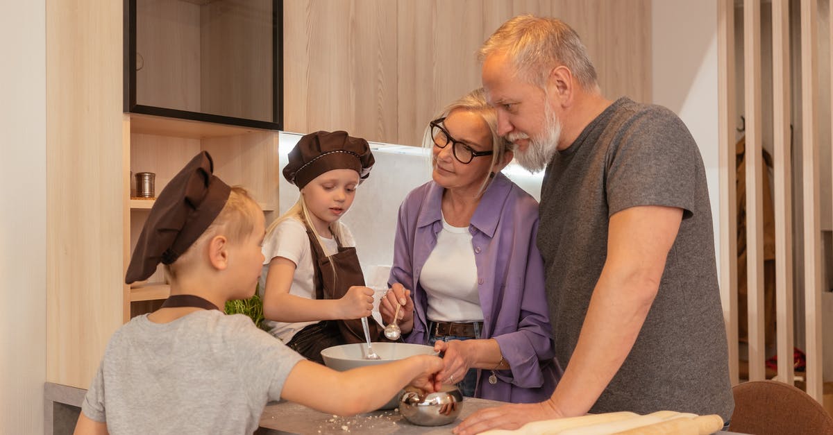 UK Railcards: Can a 'Two Together Railcard' be used for 2 adults and a 4-year old child? - An Elderly Couple Preparing in the Kitchen with their Grandchildren UK Railcards: Can a 'Two Together Railcard' be used for 2 adults and a 4-year old child? - An Elderly Couple Preparing in the Kitchen with their Grandchildren