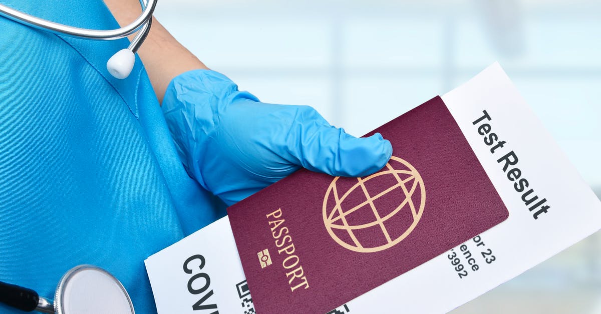 UK Standard Visitor Visa implications during travel restrictions as a result of COVID-19 outbreak? - A Close-Up Shot of a Medical Professional Holding a Passport and a Test Result UK Standard Visitor Visa implications during travel restrictions as a result of COVID-19 outbreak? - A Close-Up Shot of a Medical Professional Holding a Passport and a Test Result