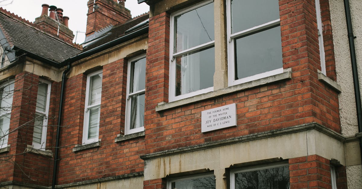 UK standard visitor visa, mistake in previous name - Brown Brick Building With White Wooden Framed Glass Window