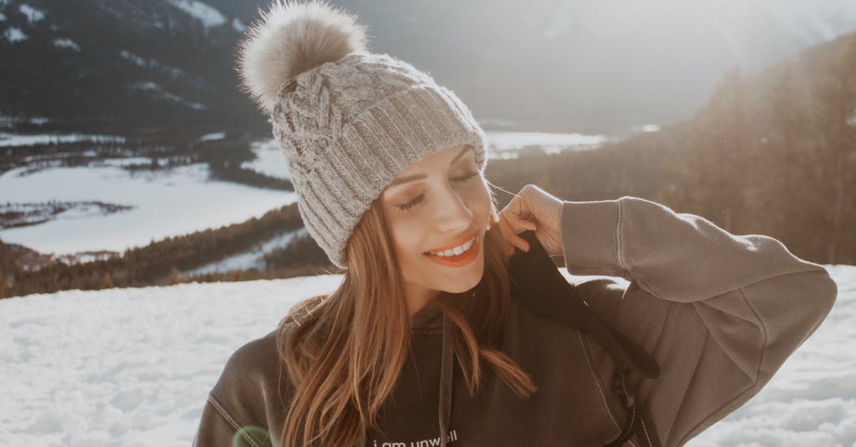 UK student on exchange in USA travelling to Canada for Christmas - Woman in Gray Knit Cap and Gray Jacket Smiling UK student on exchange in USA travelling to Canada for Christmas - Woman in Gray Knit Cap and Gray Jacket Smiling