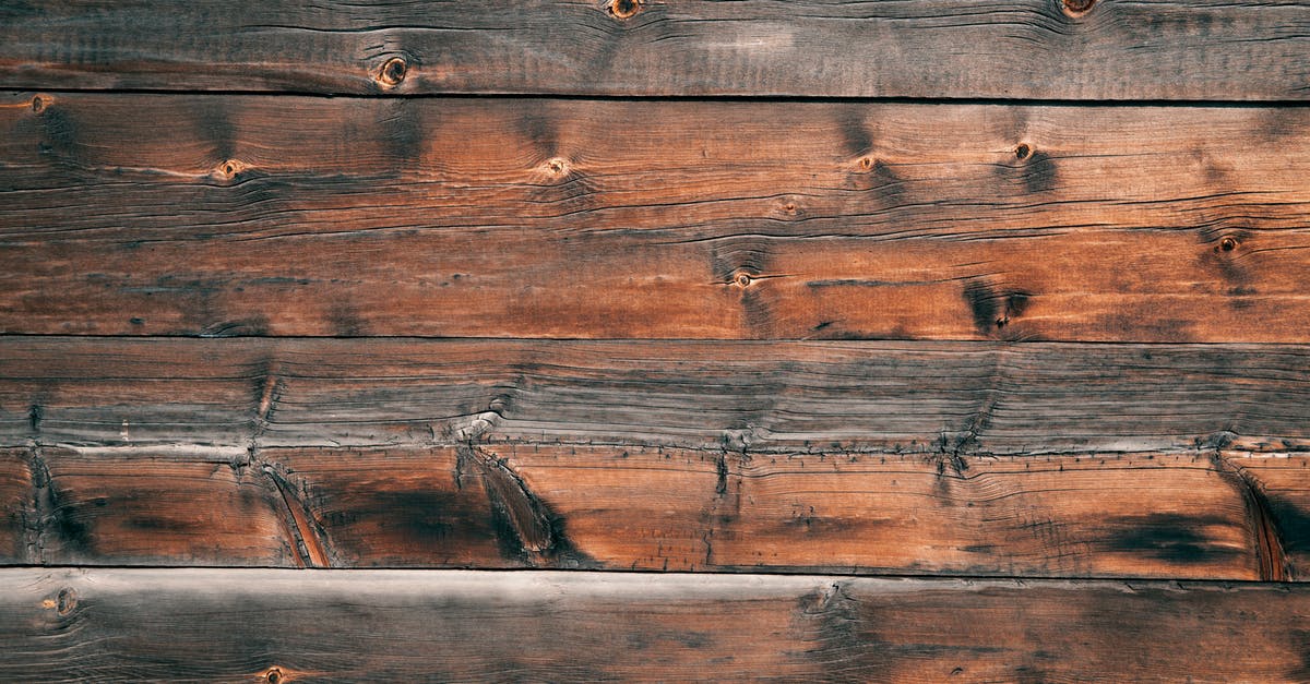 UK trains: I bought a return ticket from London Euston to Coventry. Can I board at different station? - Top view of rough wooden surface consisting from boards with different spots and patterns and colors