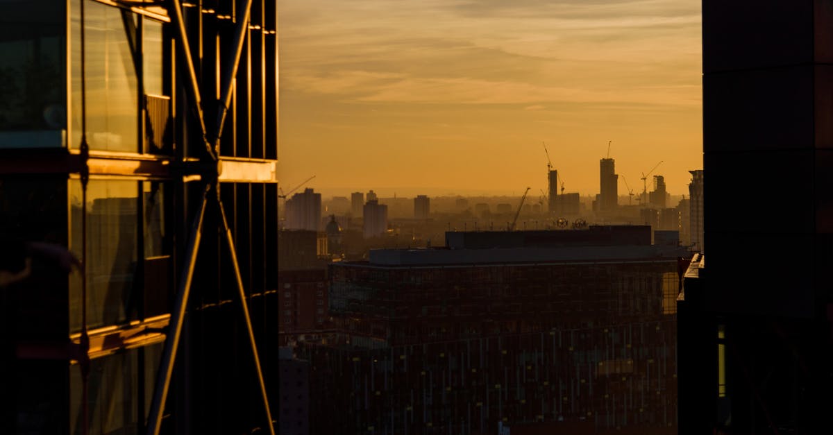 UK travel document for business owner - Sunset sky over megapolis with modern architecture UK travel document for business owner - Sunset sky over megapolis with modern architecture