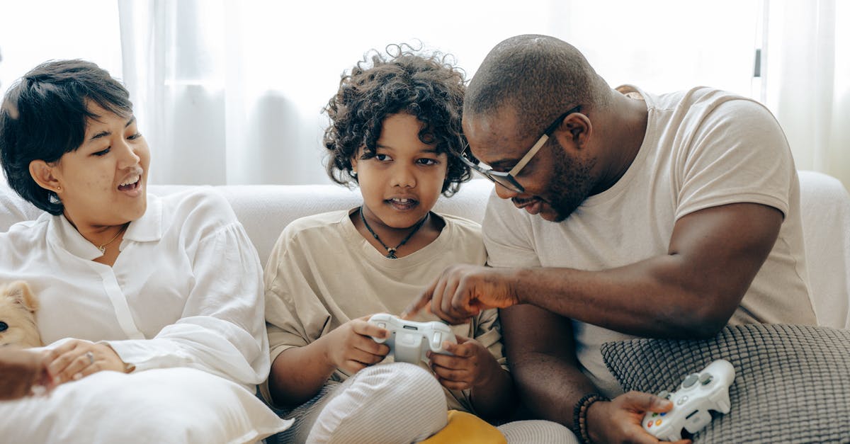 UK visa application: How to explain that I have several employers? - Concentrated black father pointing on joystick buttons explaining rules of playing to son while positive mother watching process UK visa application: How to explain that I have several employers? - Concentrated black father pointing on joystick buttons explaining rules of playing to son while positive mother watching process