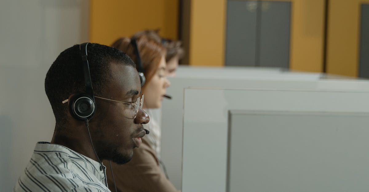 UK Visa Bronze Premium Service - Man in White and Black Stripe Shirt Wearing Black Headphones UK Visa Bronze Premium Service - Man in White and Black Stripe Shirt Wearing Black Headphones