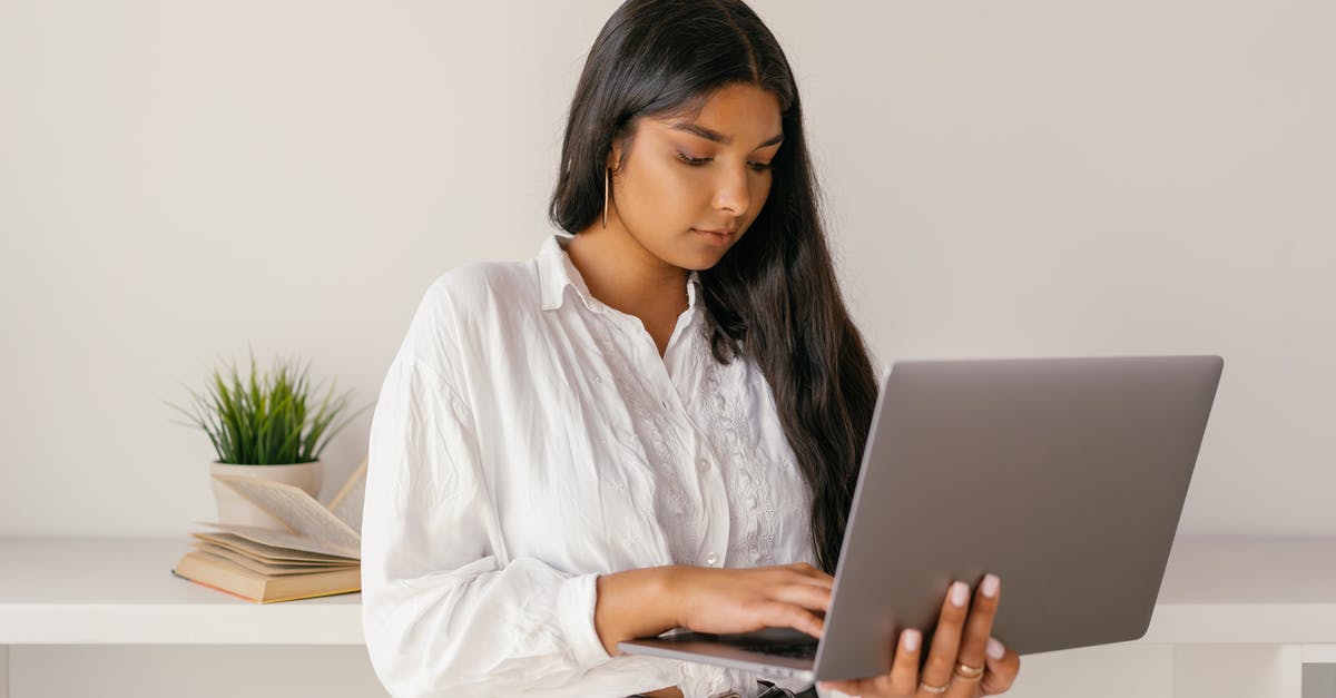 UK Visa decided but no email received - A Woman in White Dress Shirt Using a Laptop UK Visa decided but no email received - A Woman in White Dress Shirt Using a Laptop