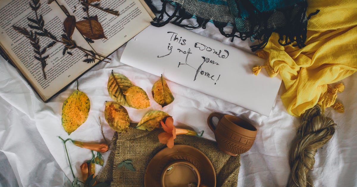 UK visa error in cover letter - From above arrangement of cups placed near opened book and colorful scarfs with envelope on white sheet with autumnal leaves UK visa error in cover letter - From above arrangement of cups placed near opened book and colorful scarfs with envelope on white sheet with autumnal leaves