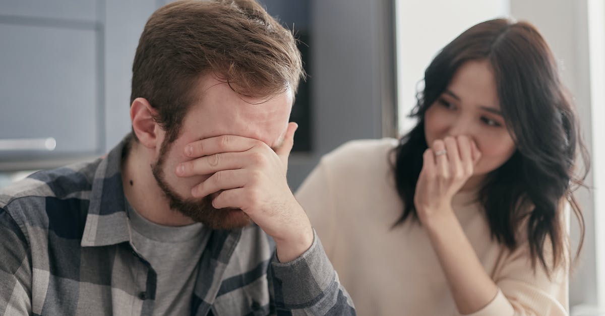 UK visa for husband - Man in a Plaid Shirt Covering His Face UK visa for husband - Man in a Plaid Shirt Covering His Face