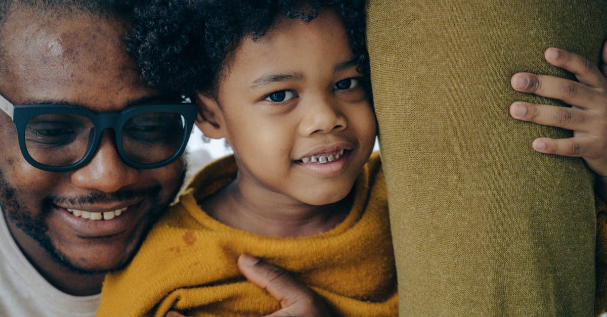 UK visa for my child refused as ECO could not be satisfied that their welfare would be taken care of (V4.11 V4.12) - Cheerful black father and son hugging UK visa for my child refused as ECO could not be satisfied that their welfare would be taken care of (V4.11 V4.12) - Cheerful black father and son hugging