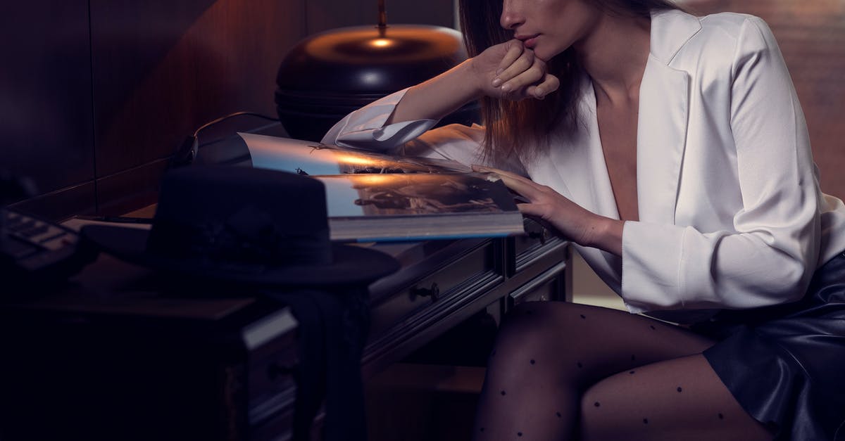 UK visa hotel booking and contact information - Elegant young lady reading magazine in cozy hotel UK visa hotel booking and contact information - Elegant young lady reading magazine in cozy hotel