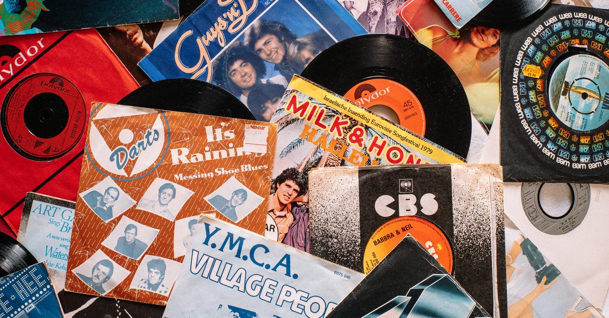 UK visa refusal due to wrong record from 9 years ago - Set of retro vinyl records on table