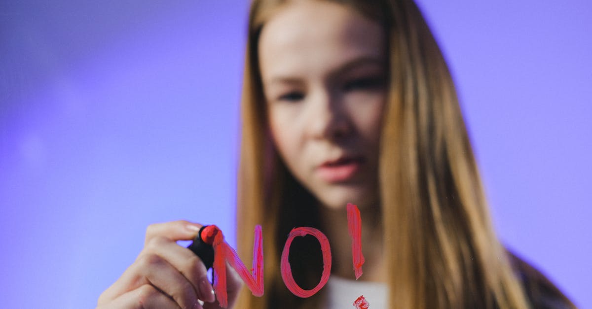 UK visa refusal for Syrian because of no proof of ties to Lebanon - Teenage girl writing No word on glass UK visa refusal for Syrian because of no proof of ties to Lebanon - Teenage girl writing No word on glass