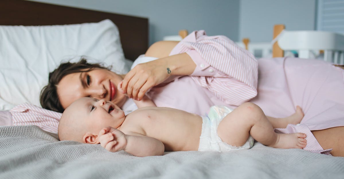UK visa refused, now I want to reapply but didn't mention my family last time - what to do? - Mother Lying Down on Bed Next to Her Baby UK visa refused, now I want to reapply but didn't mention my family last time - what to do? - Mother Lying Down on Bed Next to Her Baby