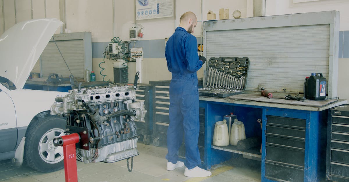 UK Visa Status check - Mechanic Fixing an Engine UK Visa Status check - Mechanic Fixing an Engine