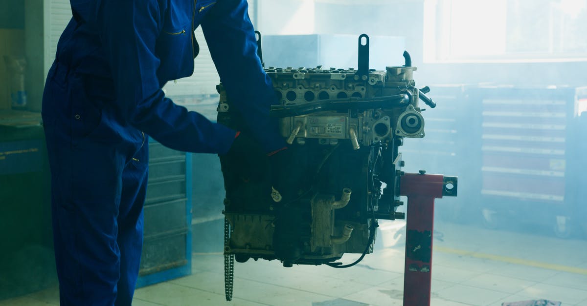 UK Visa Status check - Anonymous mechanic fixing rocket details during assembly UK Visa Status check - Anonymous mechanic fixing rocket details during assembly