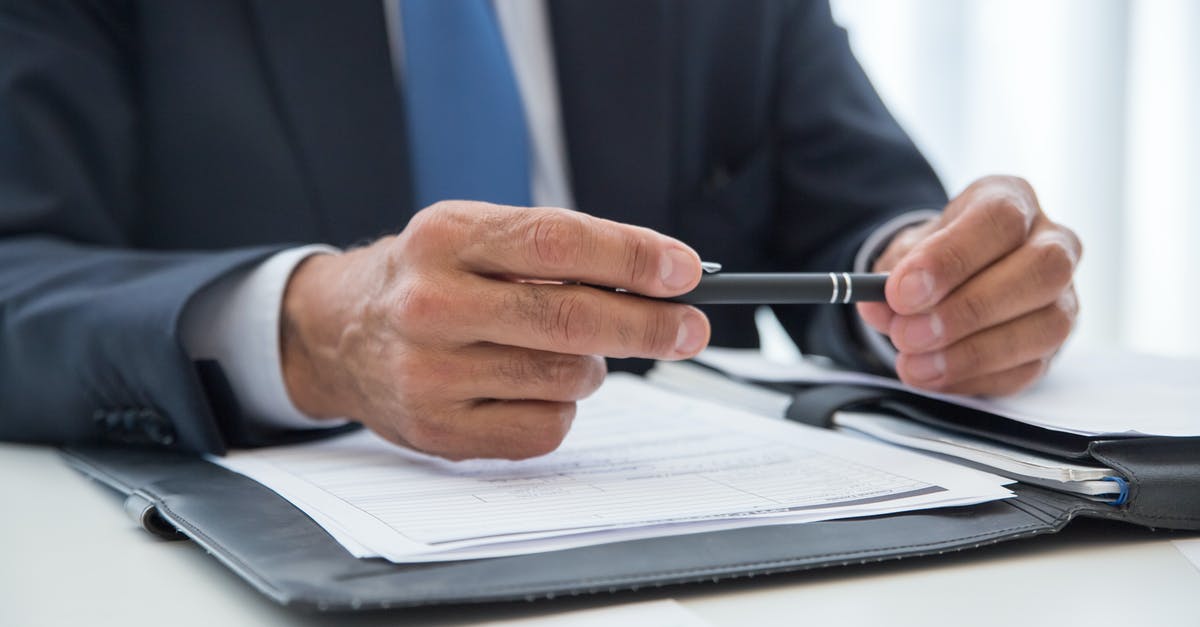 UK Visa Supporting Documents for Employer Sponsorship [closed] - Man in Blue Suit Writing on White Paper
