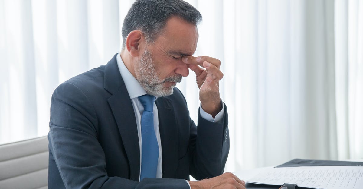 UK Visa Supporting Documents for Employer Sponsorship [closed] - Man in Black Suit Jacket Sitting by the Table