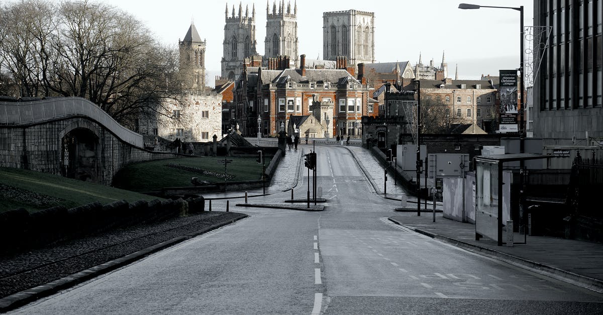 UK Visitor Visa application NY decision delayed - Brown Buildings on End of Road Under Cloudy Sky UK Visitor Visa application NY decision delayed - Brown Buildings on End of Road Under Cloudy Sky