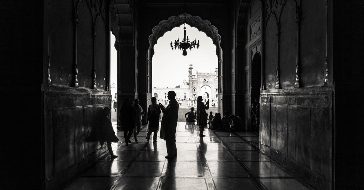 UK visitor visa from Lahore Pakistan - Monochrome Photography of People Inside Building UK visitor visa from Lahore Pakistan - Monochrome Photography of People Inside Building