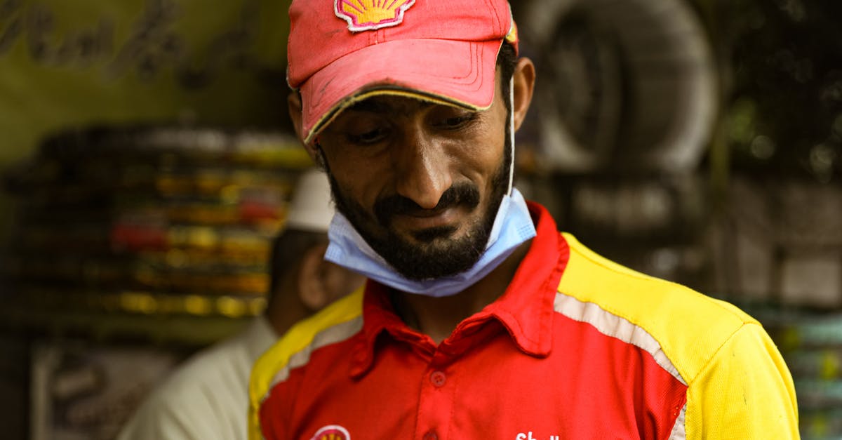 UK visitor visa from Lahore Pakistan - Man Wearing Polo Shirt and Red Cap UK visitor visa from Lahore Pakistan - Man Wearing Polo Shirt and Red Cap