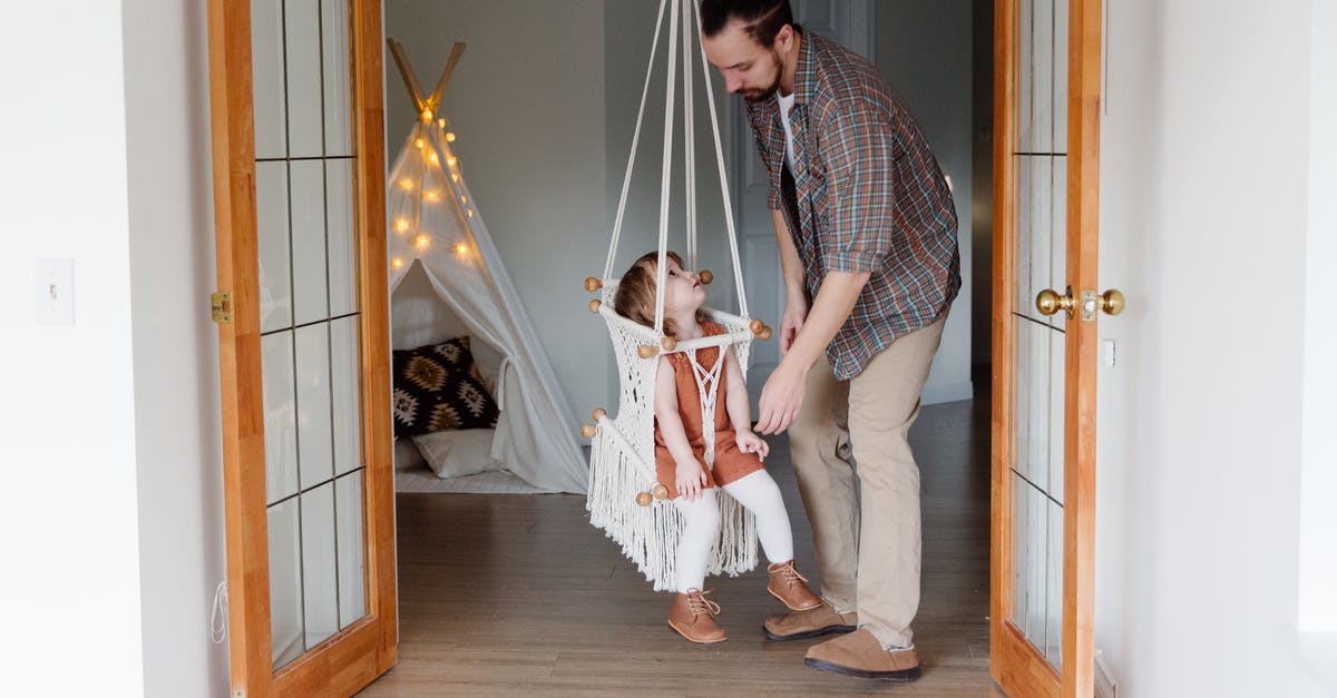 UK visitor visa rejected for my parents. Please help [closed] - Side view of young male parent in casual wear and little daughter looking at each other playing together in cozy room at home