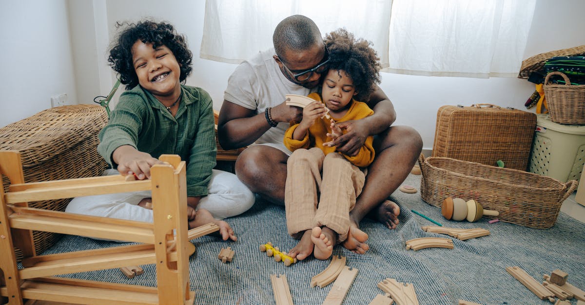 UK visitor visa rejected for my parents. Please help [closed] - Cute black girls collecting wooden details of constructor with father while spending weekend together at home