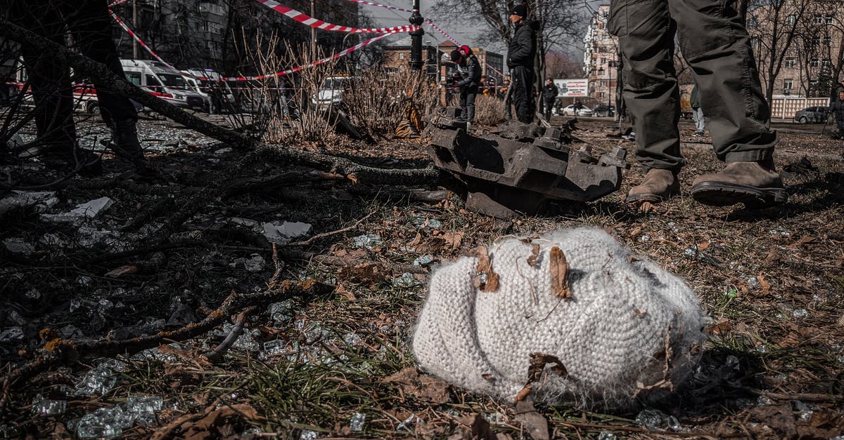 Ukrainian biometric passports - Knitted Hat Lying among Debris in Ukrainian City Ukrainian biometric passports - Knitted Hat Lying among Debris in Ukrainian City