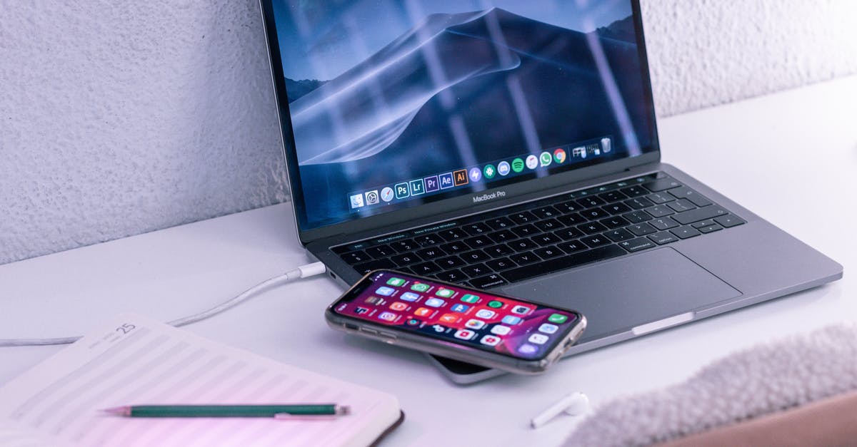 Unable to charge HP NoteBook 840 G4 laptop while being overseas - Modern laptop and smartphone near opened notepad for studies Unable to charge HP NoteBook 840 G4 laptop while being overseas - Modern laptop and smartphone near opened notepad for studies