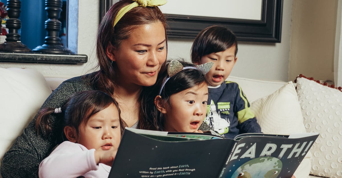 Unable to return home to China with my Chinese spouse - Woman in Green Shirt Carrying Baby Unable to return home to China with my Chinese spouse - Woman in Green Shirt Carrying Baby