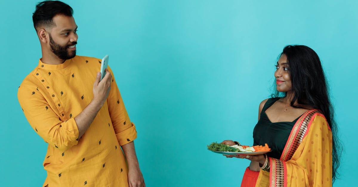 Unable to upload my photo while applying for an Indian e-Visa. What am I doing wrong? - Focused ethnic theater artist applying makeup on face Unable to upload my photo while applying for an Indian e-Visa. What am I doing wrong? - Focused ethnic theater artist applying makeup on face